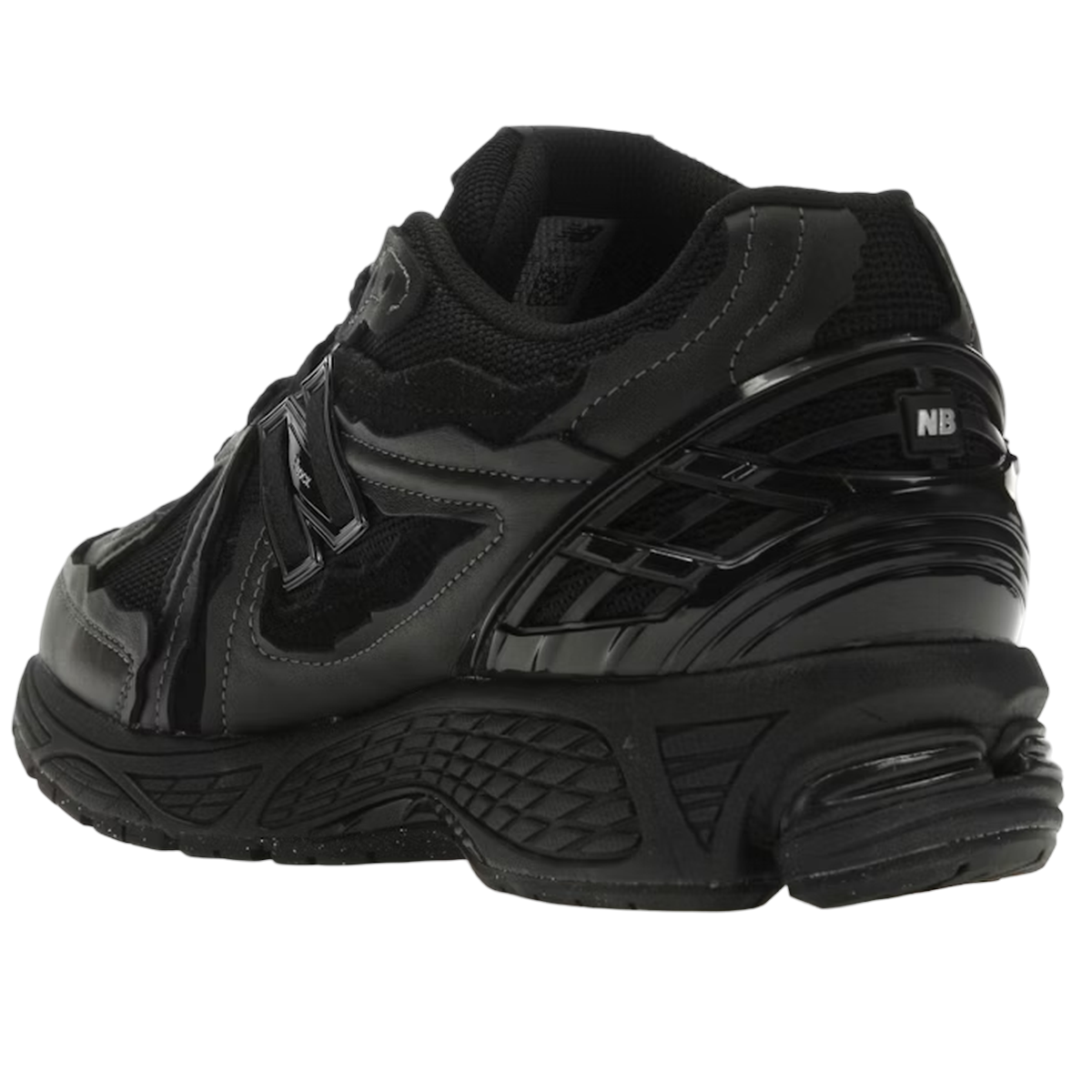New Balance 1906D Protection Pack Black Leather sneakers i profilvisning med sorte læderlag, rå kanter, N-lock snøring og sort gummiydersål